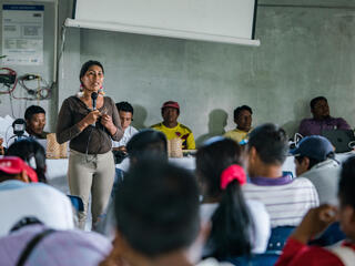 Chela Elena Umire speaks about the work and findings of the local EcosystemServices Assessment (ESA) Technical Team to leaders of the local indigenous community at LaChorrera's Annual General Meeting.