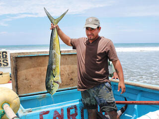 man holds fish