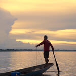 Fisherman on canoe