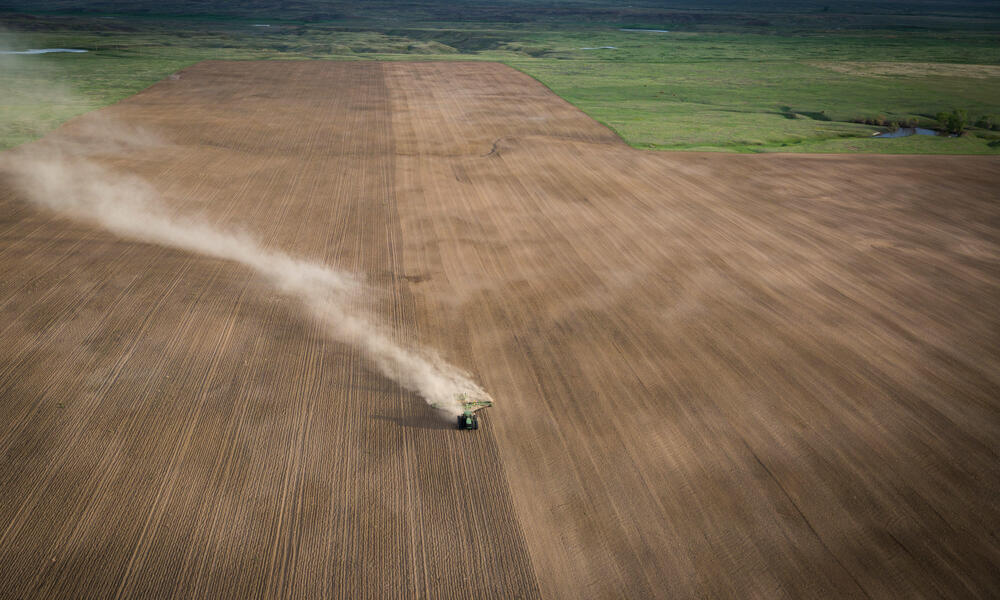 Tractor plowing developed plains land