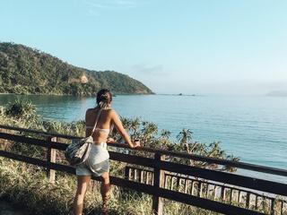 Ellie Yanagisawa looks out across a beach on Amami in the morning.